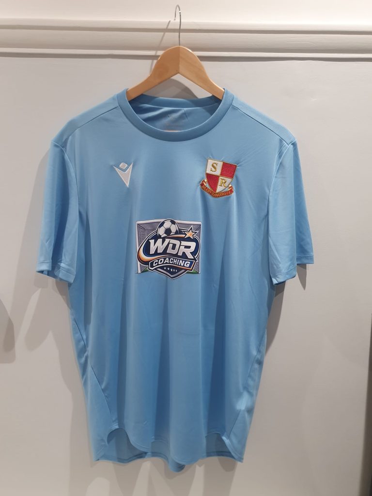 Northampton Sileby Rangers away shirt in light blue, carrying the WDR Coaching badge
